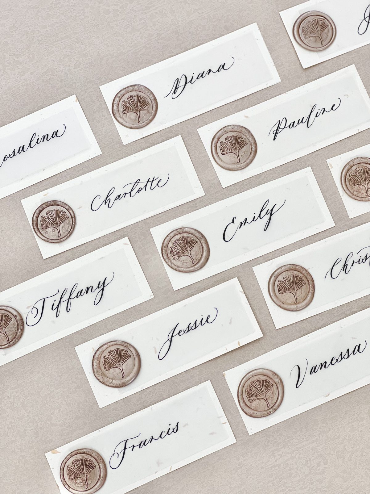Ivory envelopes addressed in calligraphy and sealed with wax for a corporate mailing