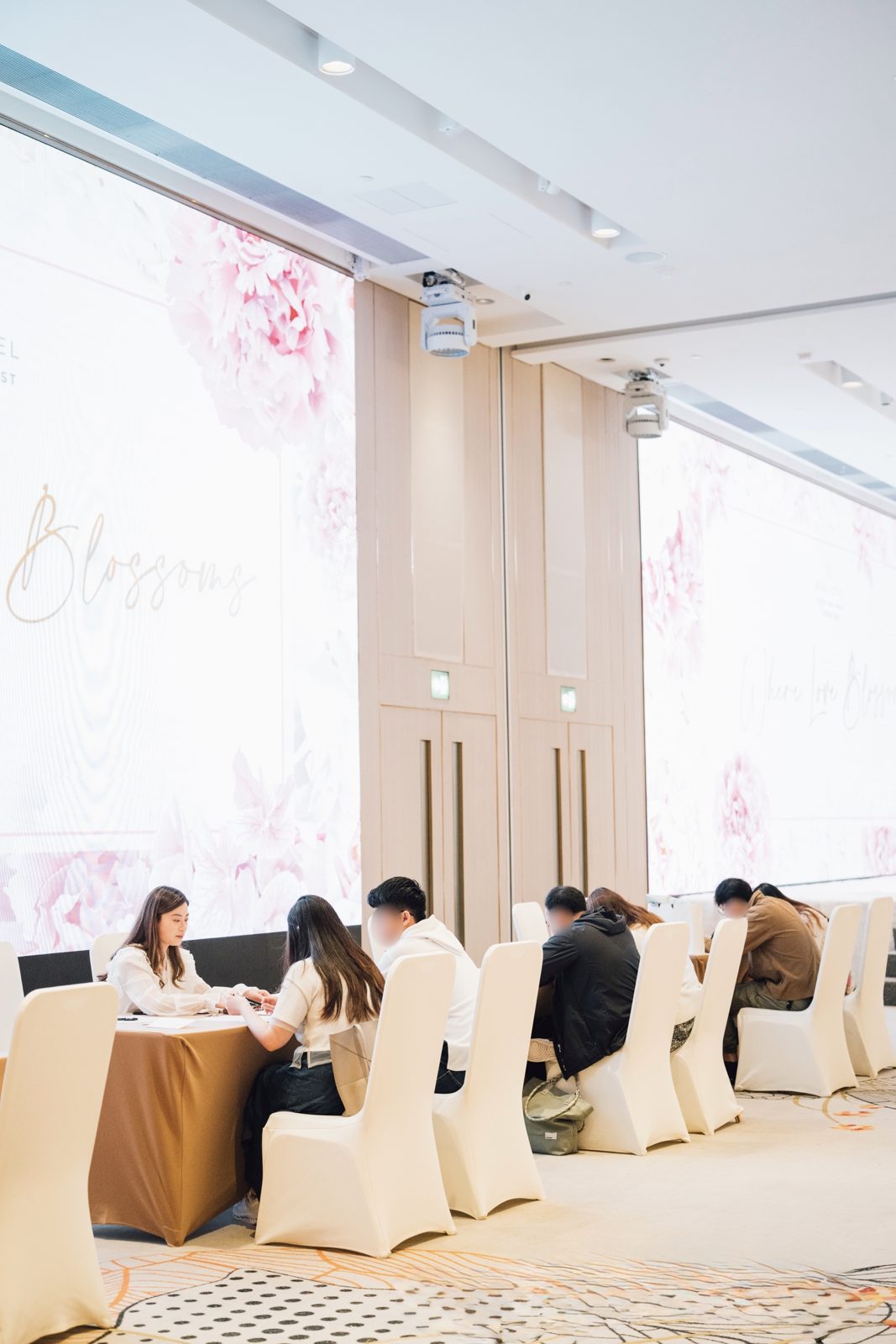 Live calligraphy station personalising gifts at a Hong Kong corporate event