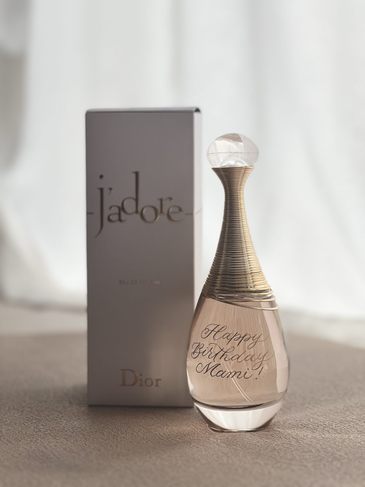 Perfume bottle engraved with a personalised message in calligraphy