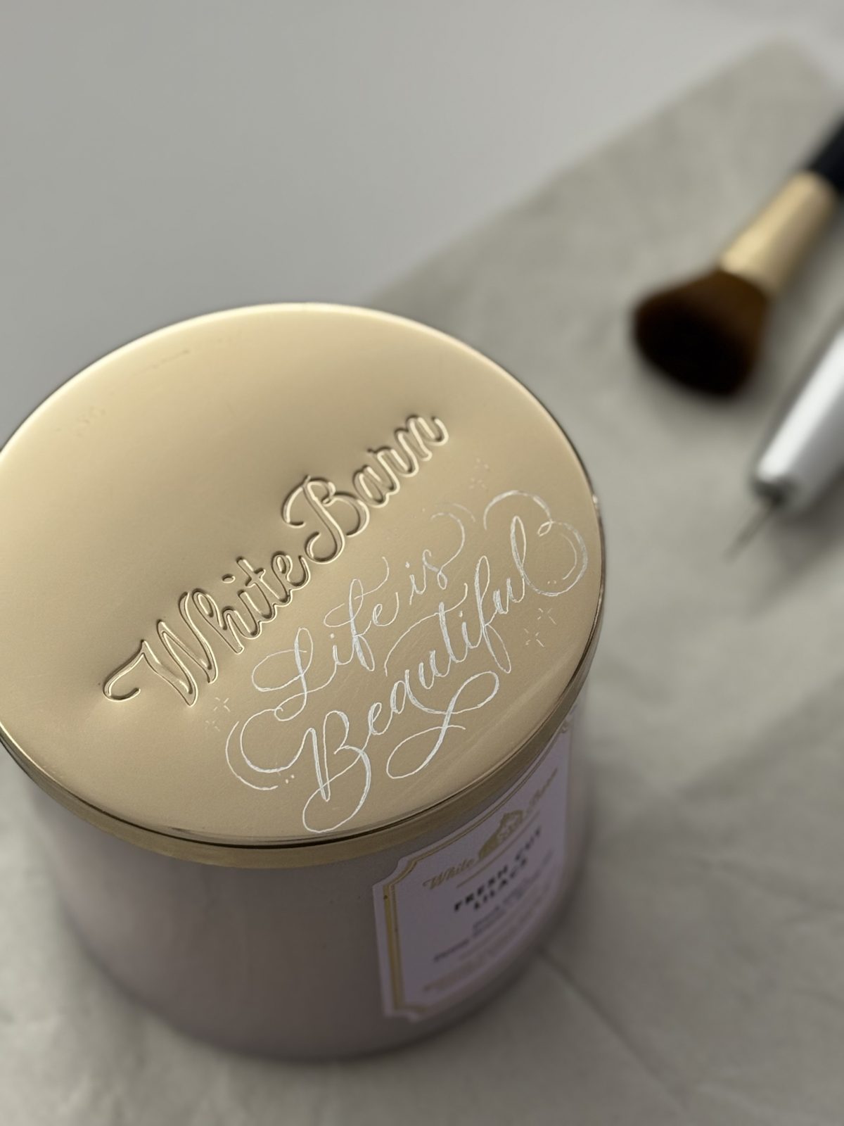 Gold beauty compact engraved with a personalised script message for a brand gifting event