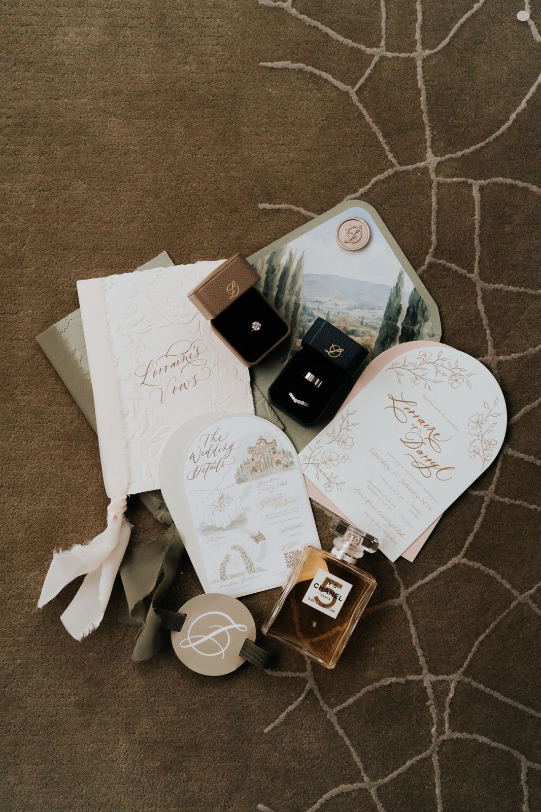 Wedding invitation suite styled with ribbon, wax seals and calligraphed names