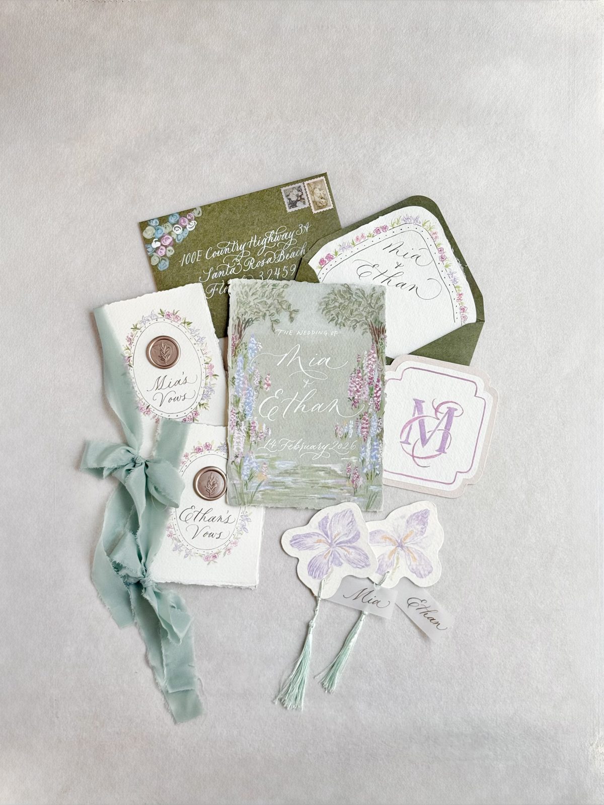 Hand calligraphed wedding keepsake suite with gold wax seals and place cards